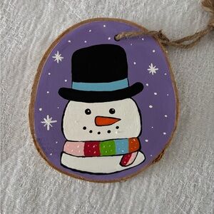 Festive Snowman Ornament with Purple Background